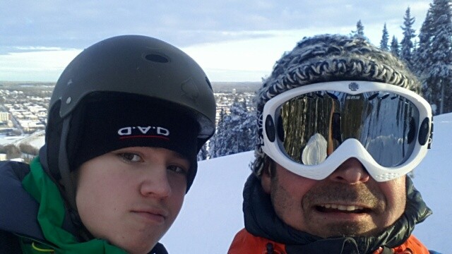 Me and my son riding snowboard